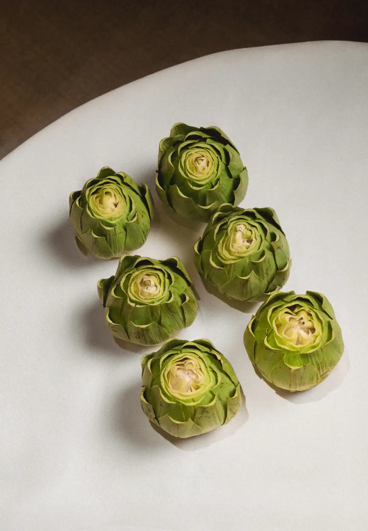 Trimmed artichokes on plate