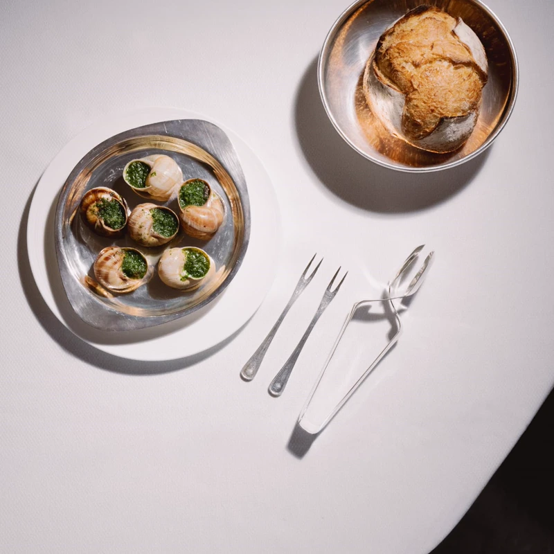 Escargots de Bourgogne in garlic parsley butter at Mazarine French restaurant, Mayfair London