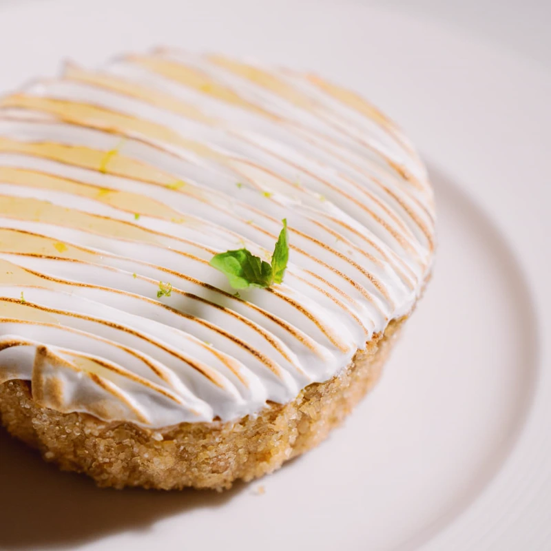 Lemon tart with torched meringue at Mazarine French restaurant in Mayfair, London