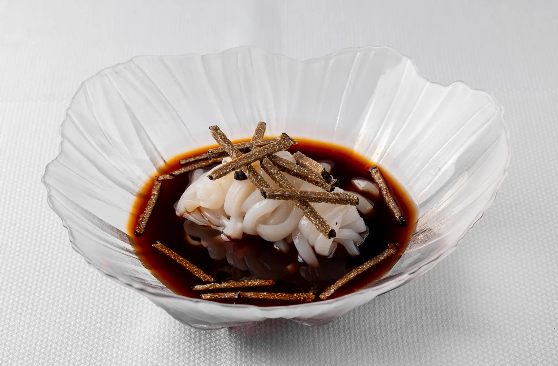 Squid with truffle in glass bowl