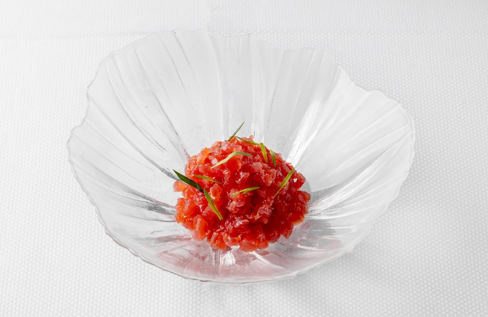 Tuna tartare in glass shell dish