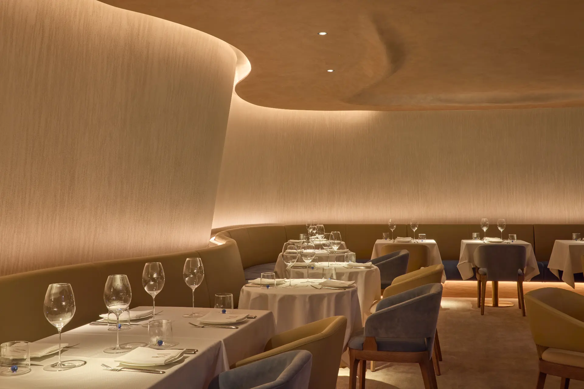 The Mazarine dining room, softly lit tables set for evening service
